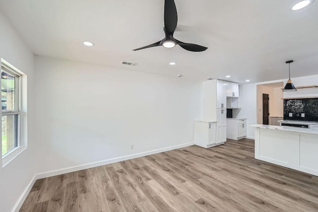 1601 N Redondo Dr, Austin, TX 78721 - unfurnished living room with ceiling fan, light wood-type flooring, and recessed lighting