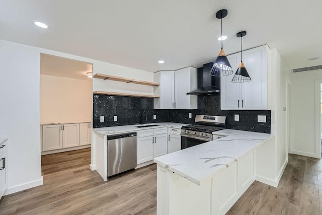 1601 N Redondo Dr, Austin, TX 78721 - kitchen featuring stainless steel appliances, open shelves, wall chimney range hood, a peninsula, and a sink