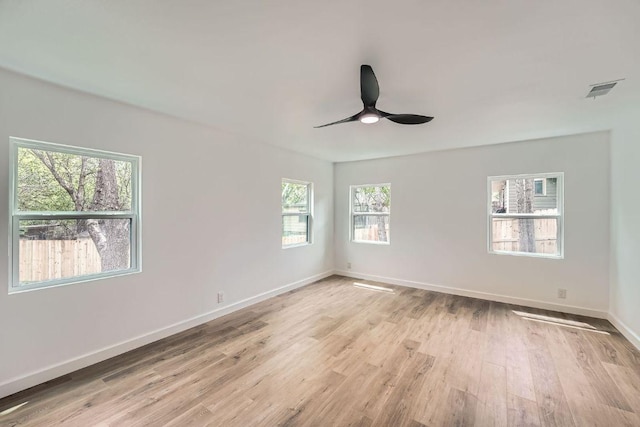 1601 N Redondo Dr, Austin, TX 78721 - empty room featuring light wood-style flooring, ceiling fan, and baseboards
