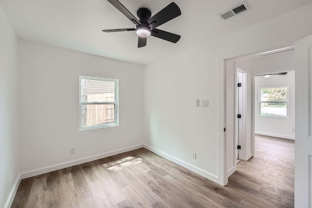 1601 N Redondo Dr, Austin, TX 78721 - empty room with ceiling fan, light wood-style floors, and baseboards