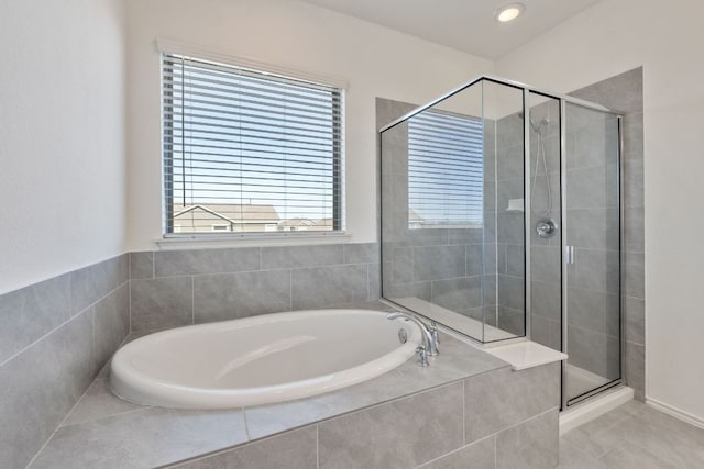 2308 Ringstaff Rd, Leander, TX 78641 - full bath with a garden tub, a stall shower, and tile patterned floors
