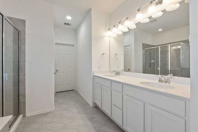 2308 Ringstaff Rd, Leander, TX 78641 - full bath featuring double vanity, a shower stall, baseboards, and recessed lighting