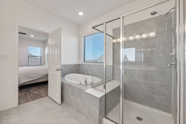 2308 Ringstaff Rd, Leander, TX 78641 - bathroom with a bath, plenty of natural light, a shower stall, connected bathroom, and recessed lighting