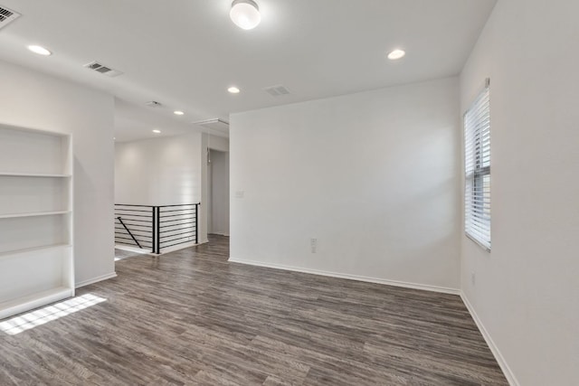 2308 Ringstaff Rd, Leander, TX 78641 - unfurnished room with wood finished floors, attic access, baseboards, and recessed lighting