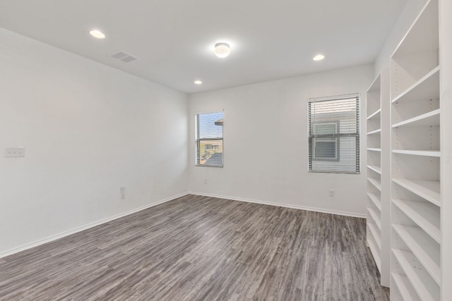 2308 Ringstaff Rd, Leander, TX 78641 - spare room with wood finished floors, healthy amount of natural light, recessed lighting, and baseboards