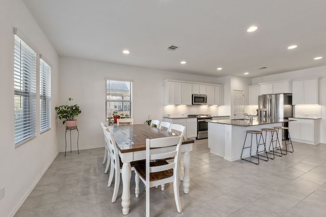 2308 Ringstaff Rd, Leander, TX 78641 - dining area with plenty of natural light, recessed lighting, baseboards, and light tile patterned floors