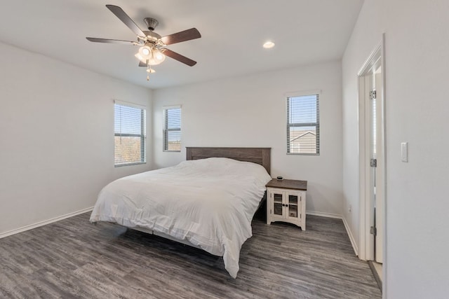 2308 Ringstaff Rd, Leander, TX 78641 - bedroom with multiple windows, wood finished floors, and baseboards