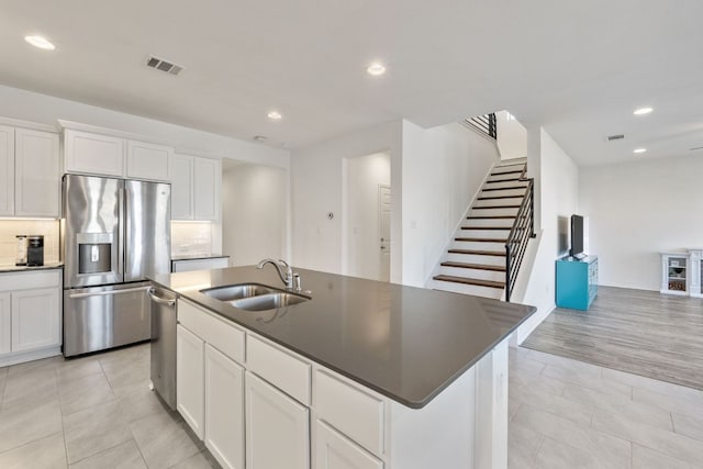 2308 Ringstaff Rd, Leander, TX 78641 - kitchen with stainless steel appliances, a sink, recessed lighting, backsplash, and dark countertops