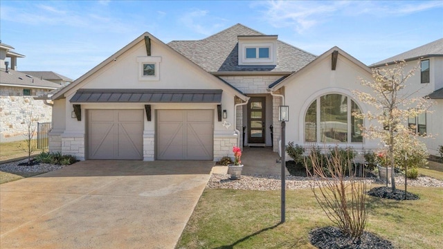 209 Gulfton St, Austin, TX 78738 - view of front of property featuring stone siding, concrete driveway, a standing seam roof, a front lawn, and metal roof