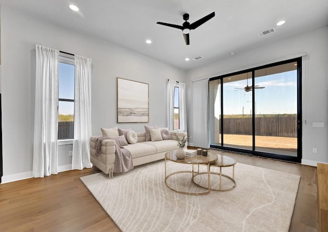7200 Cordoba Dr, Austin, TX 78724 - living room featuring a ceiling fan, wood finished floors, baseboards, and recessed lighting