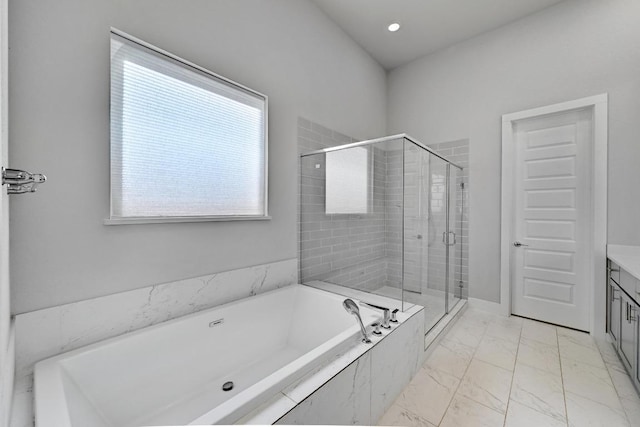 7200 Cordoba Dr, Austin, TX 78724 - full bathroom featuring a garden tub, marble look tiles, a stall shower, vanity, and recessed lighting