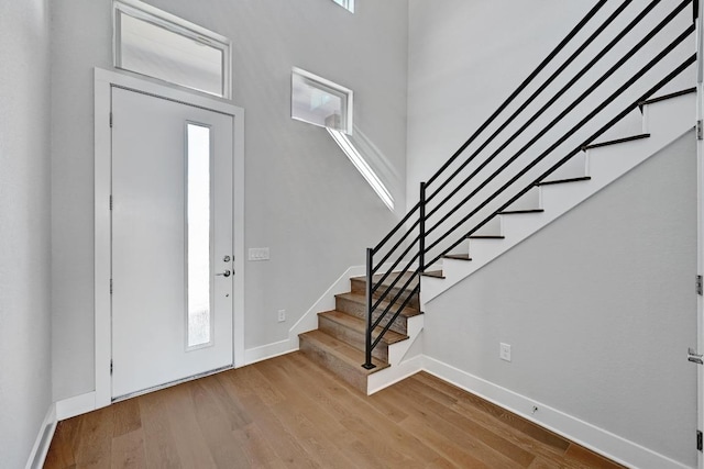 7200 Cordoba Dr, Austin, TX 78724 - entrance foyer featuring wood finished floors, stairs, and plenty of natural light