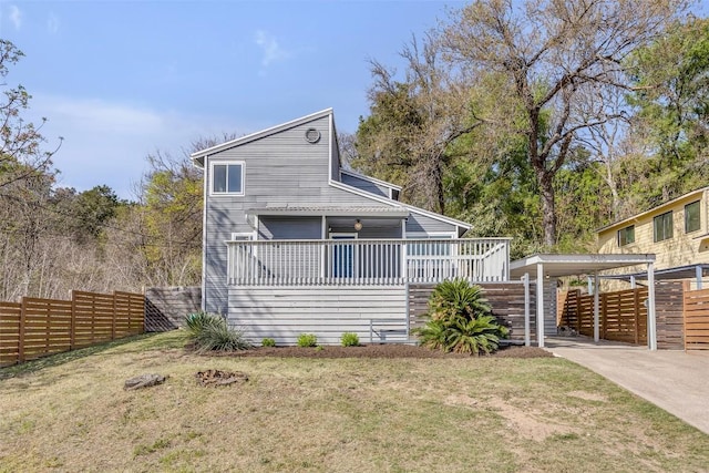3510 Oak Springs Dr, Austin, TX 78721 - view of front of property with a carport, a deck, and concrete driveway