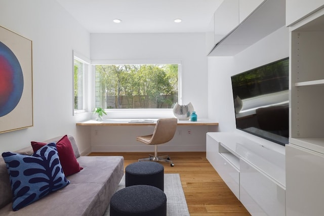 office space with recessed lighting and light wood-style floors