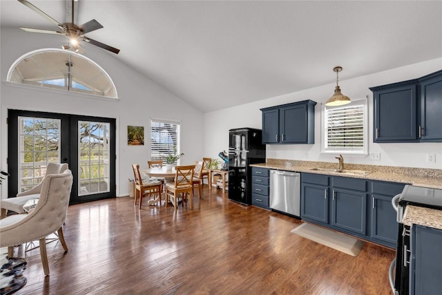 5898 River Oaks Dr, Kingsland, TX 78639 - kitchen with french doors, dark wood-style flooring, a sink, and appliances with stainless steel finishes