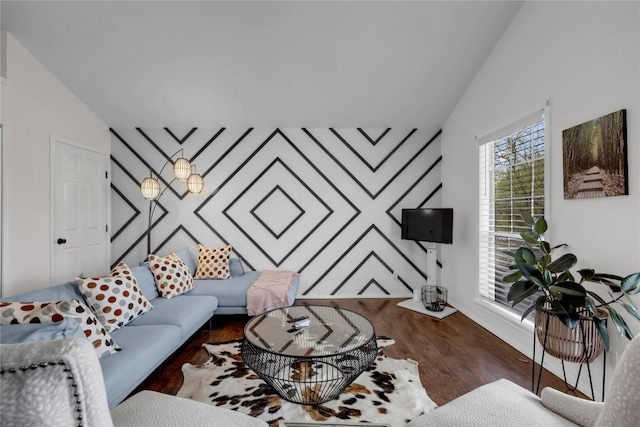 5898 River Oaks Dr, Kingsland, TX 78639 - living area with lofted ceiling, wood finished floors, and an accent wall