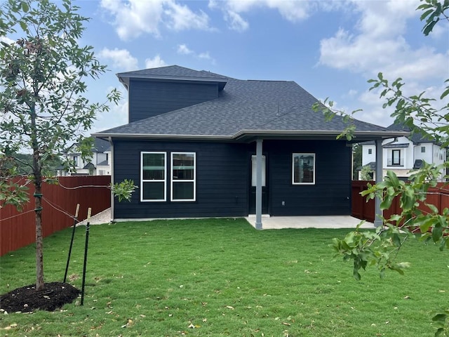 1703 Kit Cir, Austin, TX 78758 - rear view of house featuring a patio area, a shingled roof, and a fenced backyard