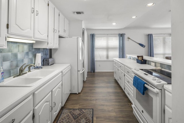 2546 Williams Lakeshore, Kingsland, TX 78639 - kitchen featuring white appliances, a sink, white cabinets, tasteful backsplash, and light countertops