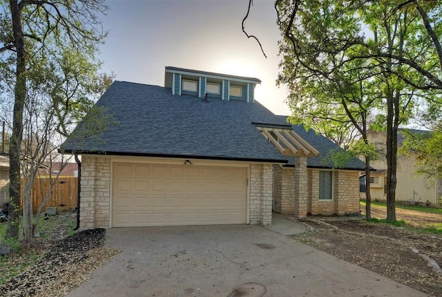 1701 Indian Camp Trl, Round Rock, TX 78681 - view of front of house with a shingled roof, stone siding, concrete driveway, and a garage