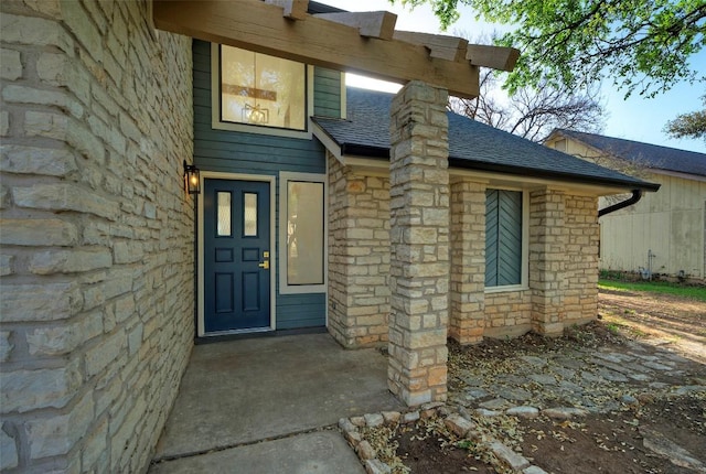 1701 Indian Camp Trl, Round Rock, TX 78681 - view of exterior entry featuring stone siding and a shingled roof