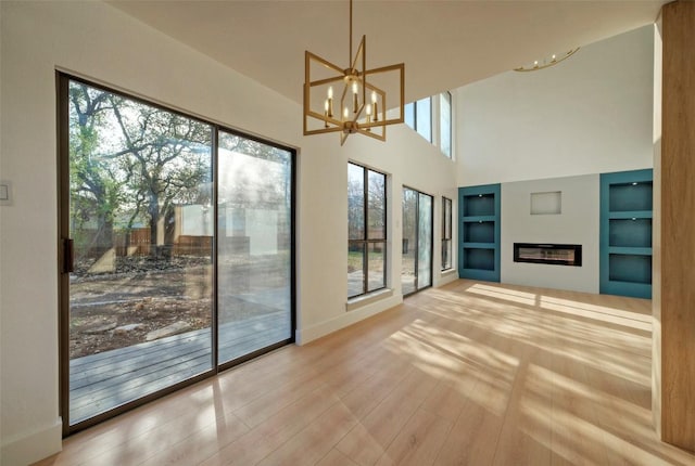 1701 Indian Camp Trl, Round Rock, TX 78681 - unfurnished sunroom featuring a chandelier