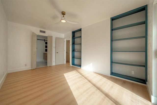 1701 Indian Camp Trl, Round Rock, TX 78681 - empty room featuring wood finished floors and ceiling fan