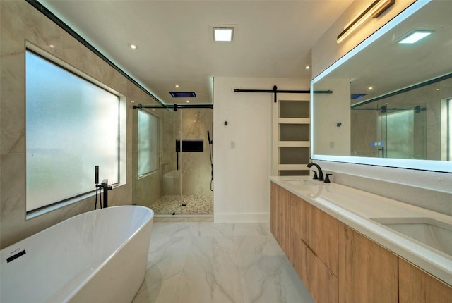 1701 Indian Camp Trl, Round Rock, TX 78681 - bathroom featuring a shower stall, a freestanding tub, marble tiled flooring, double vanity, and plenty of natural light