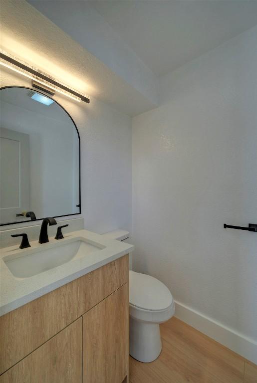 1701 Indian Camp Trl, Round Rock, TX 78681 - bathroom with vanity and wood finished floors