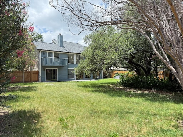 1701 Indian Camp Trl, Round Rock, TX 78681 - rear view of house with a chimney and a shingled roof