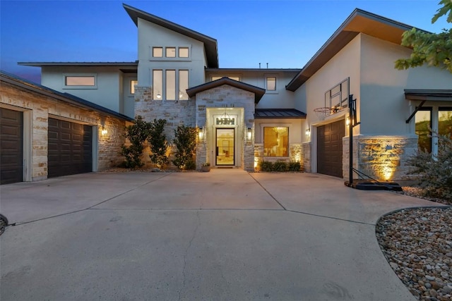 204 Ringtail Stream Dr, Lakeway, TX 78738 - modern home featuring stone siding, concrete driveway, stucco siding, and an attached garage