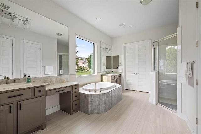 204 Ringtail Stream Dr, Lakeway, TX 78738 - bathroom with a stall shower, two vanities, and a bath