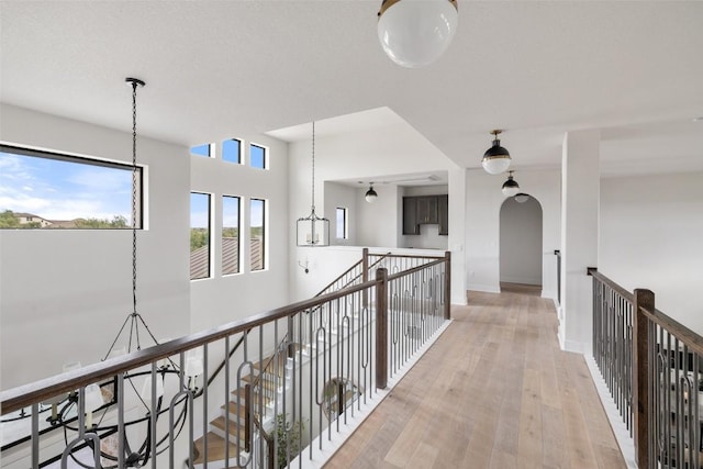 204 Ringtail Stream Dr, Lakeway, TX 78738 - hall featuring light wood-type flooring, an upstairs landing, and baseboards