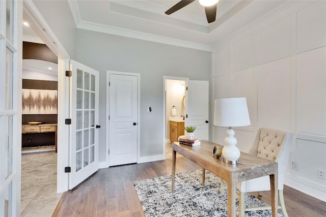 104 Standing Oak Dr, Georgetown, TX 78633 - office featuring ceiling fan, a raised ceiling, wood finished floors, crown molding, and french doors