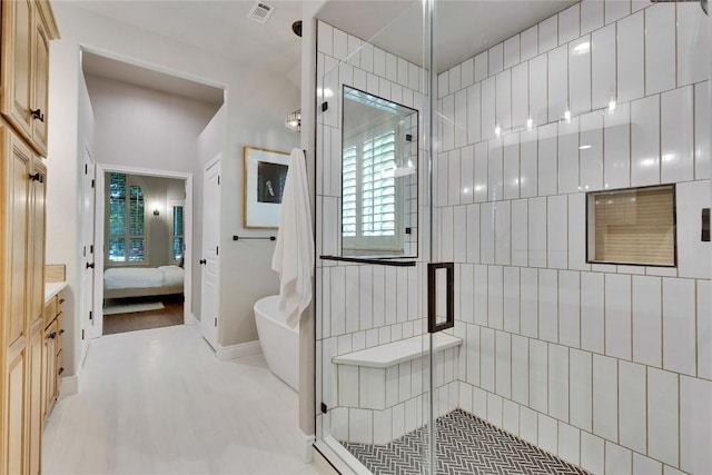 104 Standing Oak Dr, Georgetown, TX 78633 - bathroom with ensuite bathroom, a shower stall, vanity, and a soaking tub