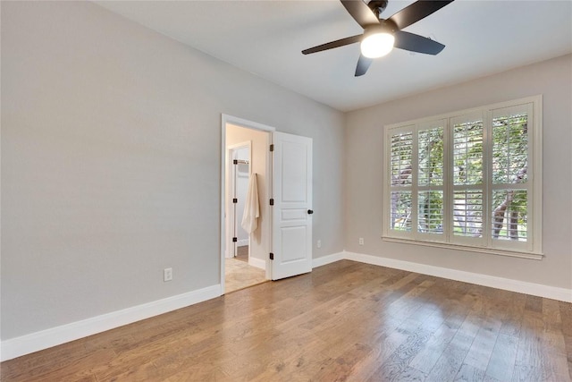 104 Standing Oak Dr, Georgetown, TX 78633 - unfurnished room with baseboards, a ceiling fan, and wood finished floors