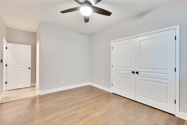 104 Standing Oak Dr, Georgetown, TX 78633 - unfurnished bedroom featuring light wood-style flooring, baseboards, and ceiling fan