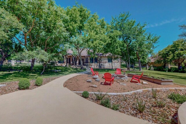 104 Standing Oak Dr, Georgetown, TX 78633 - view of community with a lawn and a fire pit