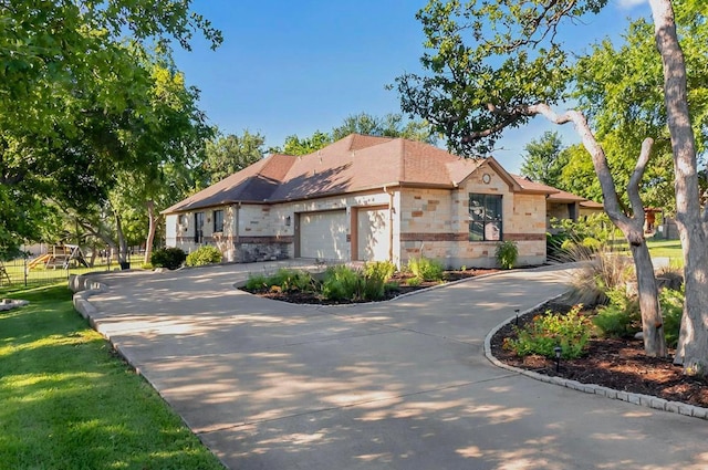 104 Standing Oak Dr, Georgetown, TX 78633 - view of front of home with driveway, a garage, stone siding, and roof with shingles