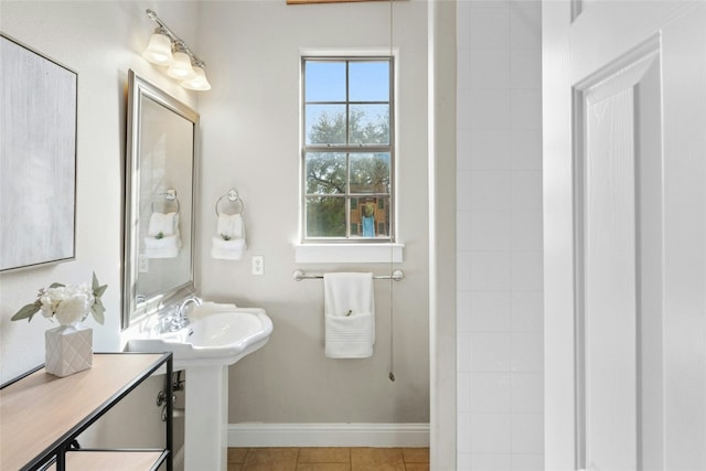 1420 Mirador, Leander, TX 78641 - bathroom featuring baseboards and tile patterned flooring