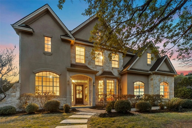 1420 Mirador, Leander, TX 78641 - view of front of house with stone siding, stucco siding, and a lawn