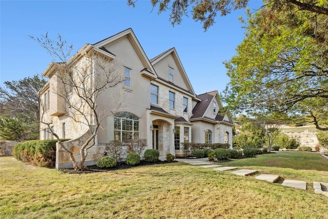 1420 Mirador, Leander, TX 78641 - view of front of home with stucco siding, stone siding, and a front lawn