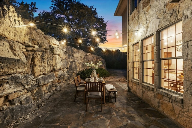 1420 Mirador, Leander, TX 78641 - patio terrace at dusk featuring a patio area and outdoor dining area