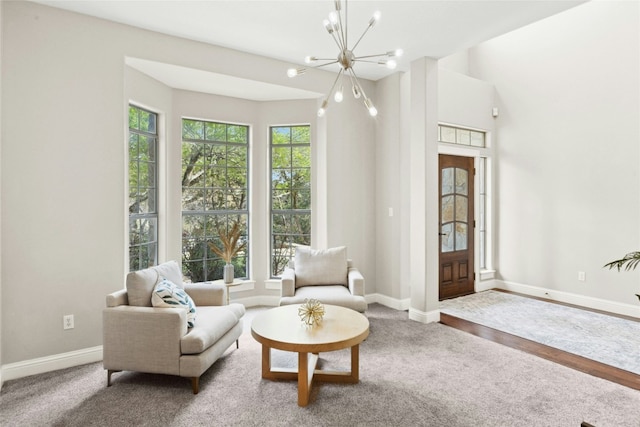 1420 Mirador, Leander, TX 78641 - carpeted living room featuring a chandelier and baseboards