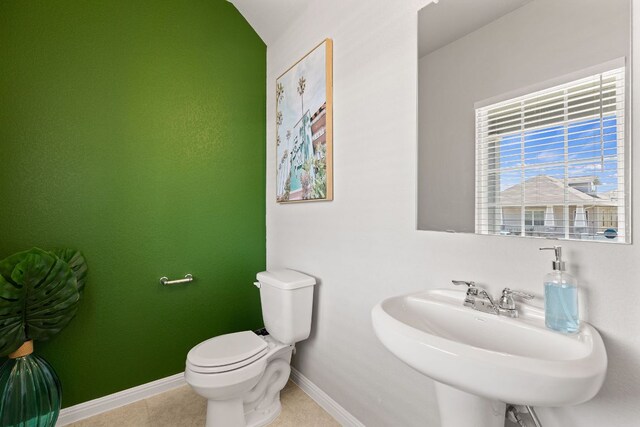 217 Timber Brook Dr, Hutto, TX 78634 - half bath with a sink and tile patterned floors