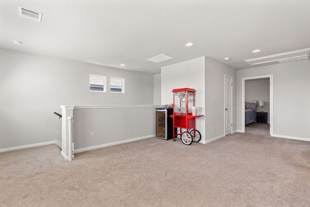 217 Timber Brook Dr, Hutto, TX 78634 - playroom featuring attic access, carpet, and recessed lighting