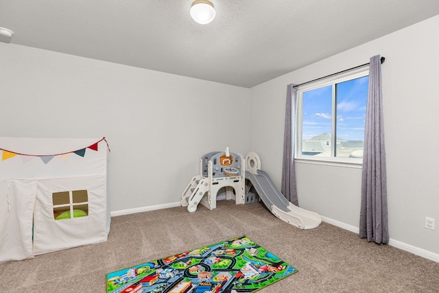 217 Timber Brook Dr, Hutto, TX 78634 - rec room with carpet floors and baseboards