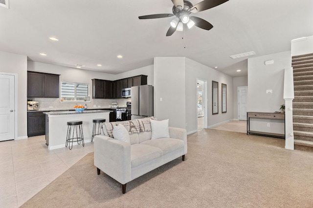 217 Timber Brook Dr, Hutto, TX 78634 - living room with ceiling fan, recessed lighting, stairs, and light tile patterned floors