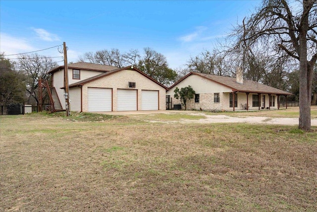 view of front of home with a front lawn and brick siding