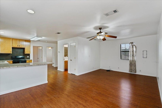 5014 Little Valley Rd, Leander, TX 78641 - unfurnished living room featuring a ceiling fan and dark wood-style floors