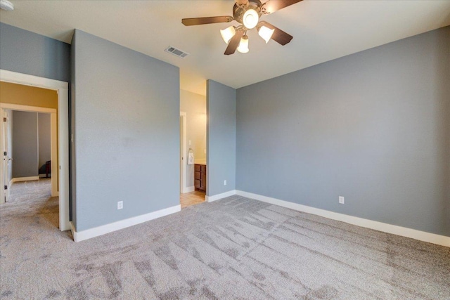 10242 Brangus Rd, Driftwood, TX 78619 - unfurnished bedroom with light carpet, lofted ceiling, ceiling fan, and ensuite bathroom